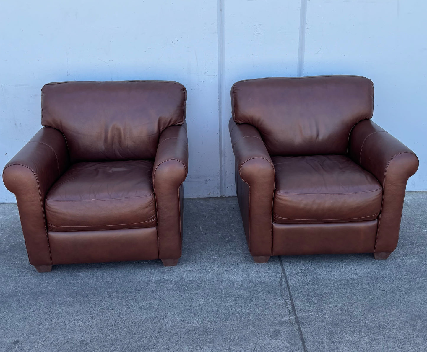Brown leather armchairs
