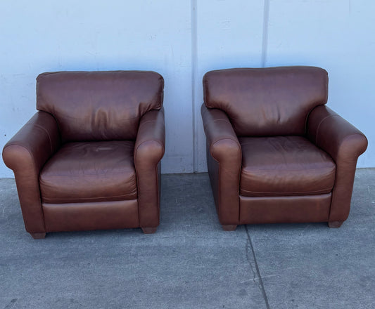 Brown leather armchairs