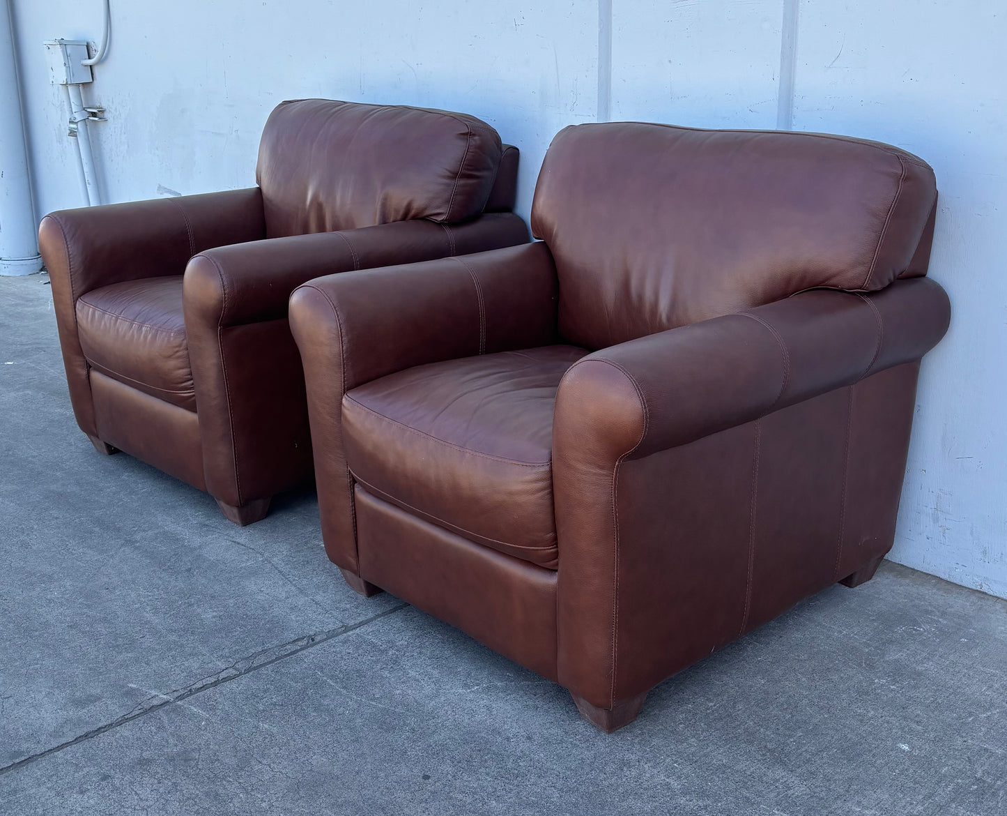 Brown leather armchairs