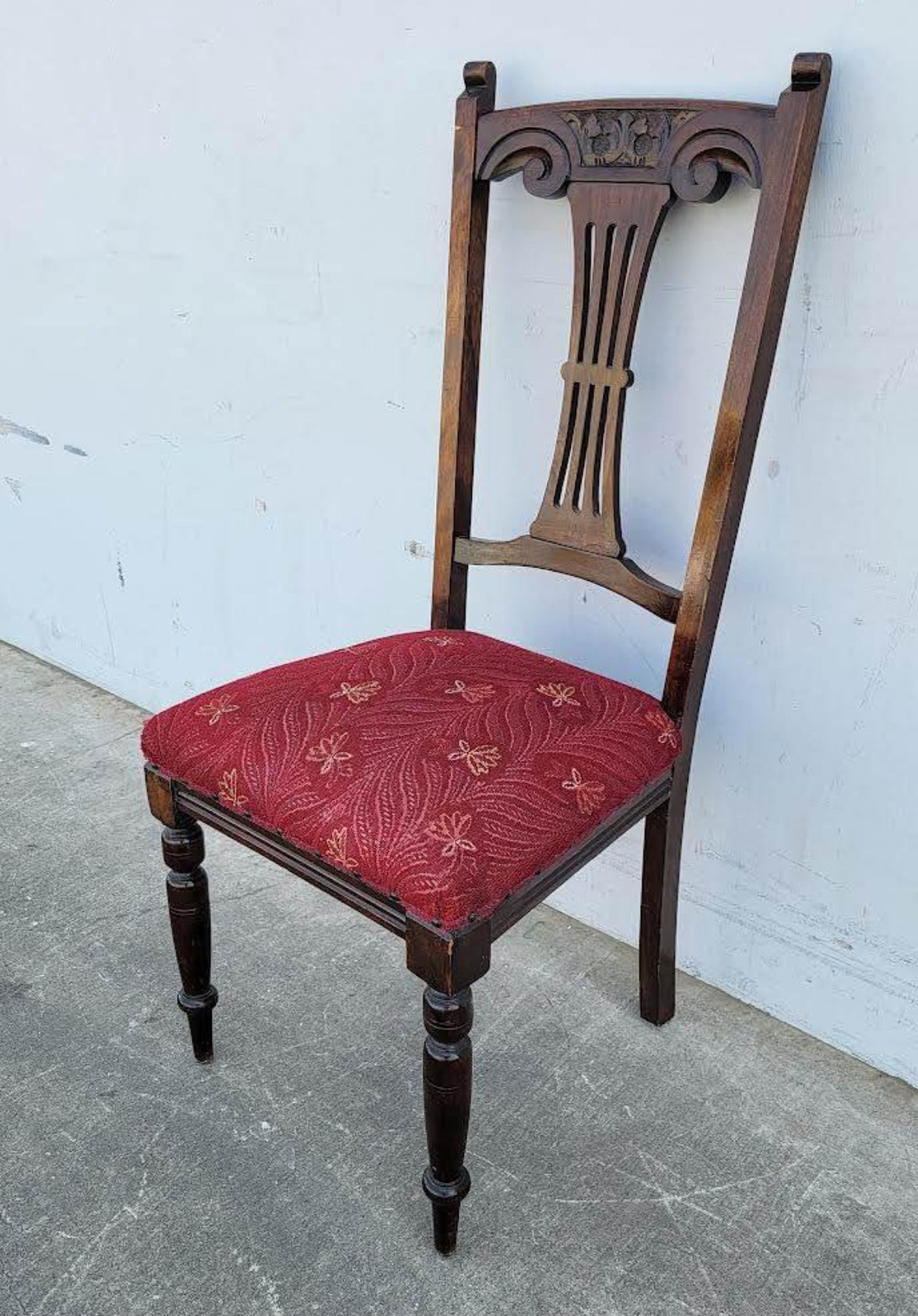 Antique carved chair burgundy cushion