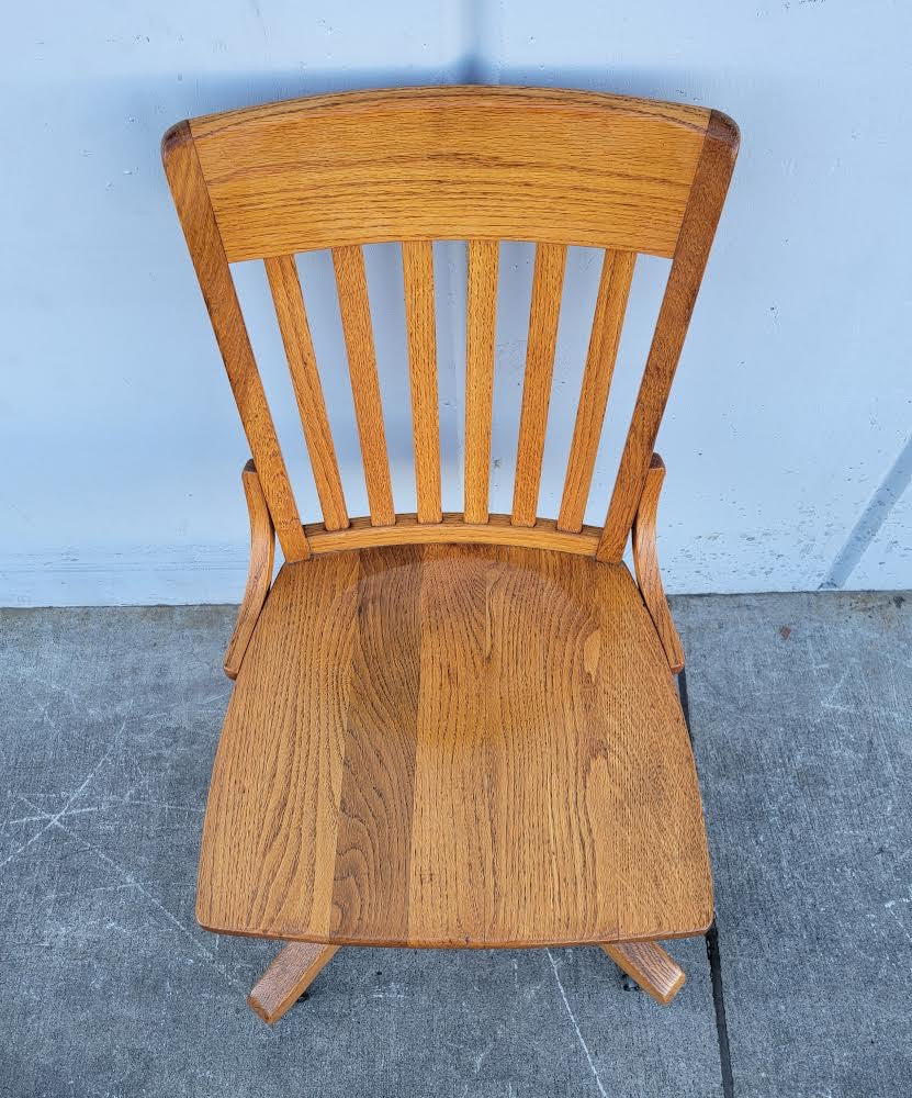 Antique/ vintage oak swivel office/bankers rolling chair on wheels