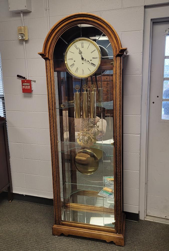 howard miller grandfather clock with curio