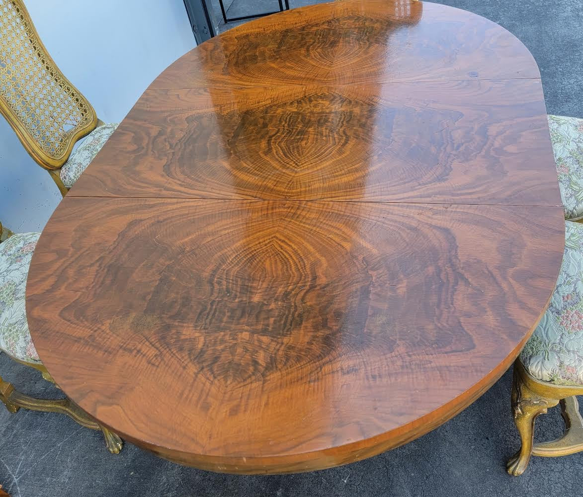 Dining table with 6 wicker high back chairs and leaf