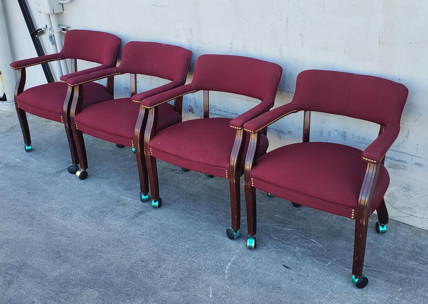 Burgundy Captain guest chairs with casters (4)