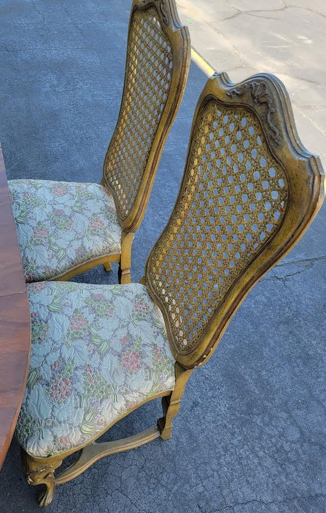 Dining table with 6 wicker high back chairs and leaf