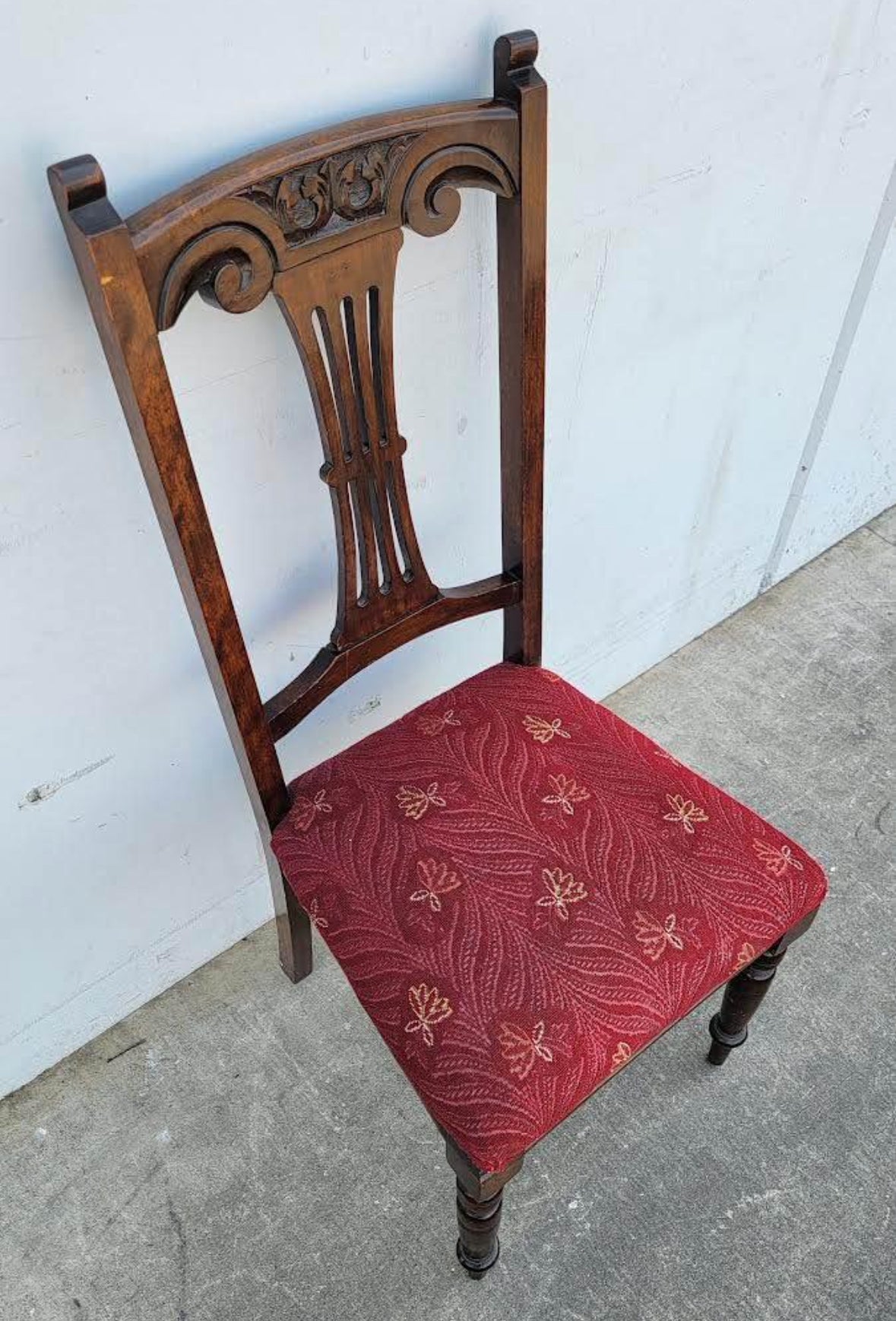 Antique carved chair burgundy cushion