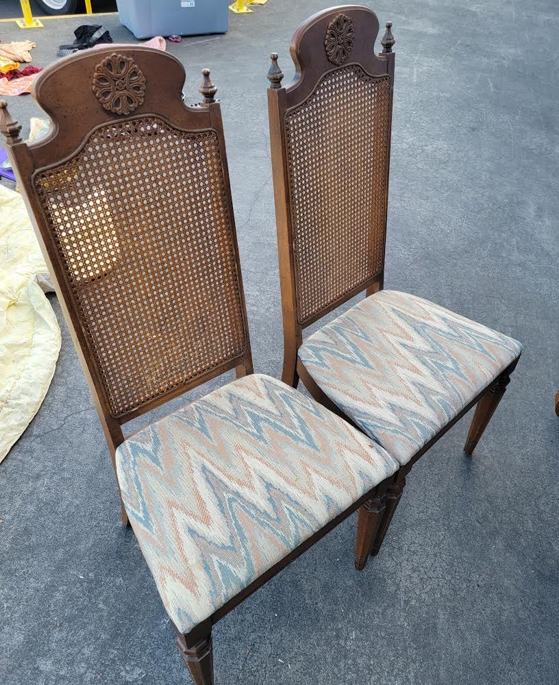 Dark wood dining table with 6 wicker/cane/ rattan high back chairs and 3 leaves