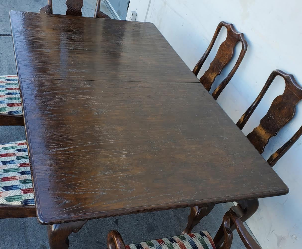 Dark wood dining table with 6 chairs