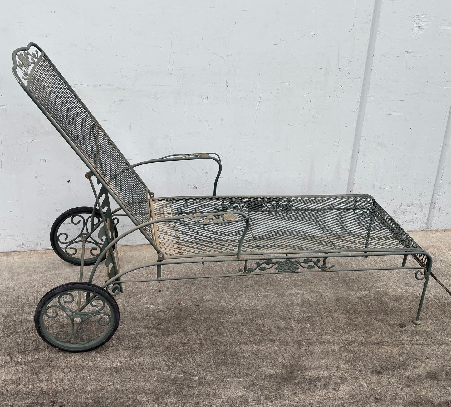 Vintage Wrought iron flower patter garden chaise lounge chair with wheels