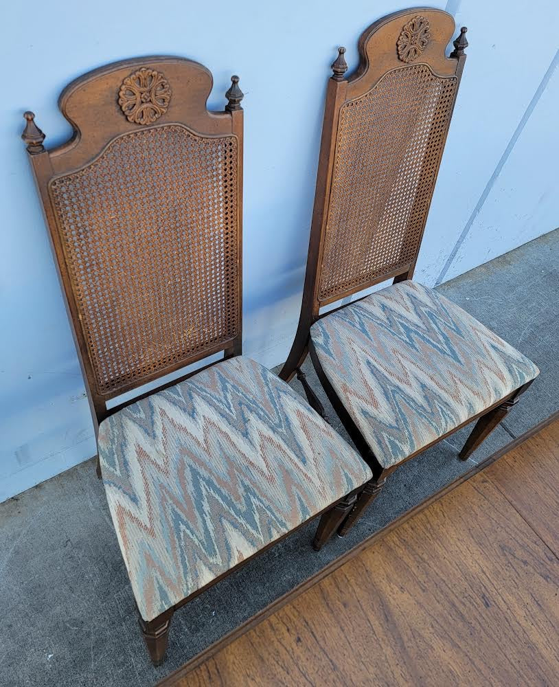 Dark wood dining table with 6 wicker/cane/ rattan high back chairs and 3 leaves