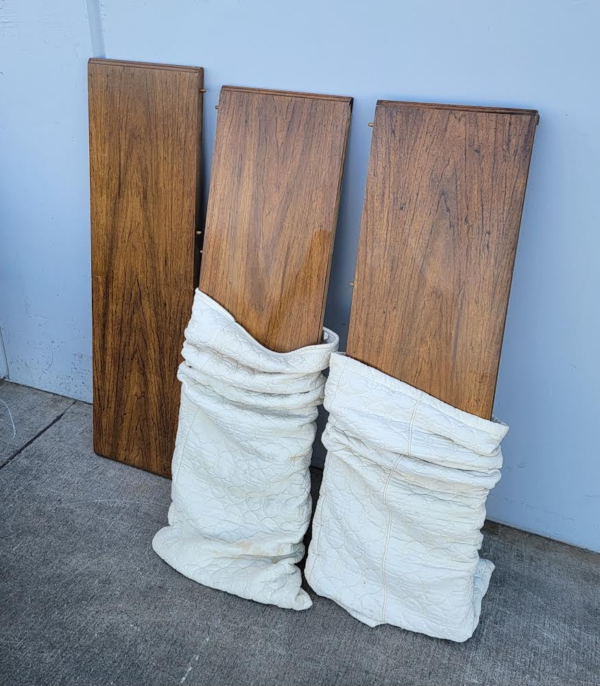 Dark wood dining table with 6 wicker/cane/ rattan high back chairs and 3 leaves