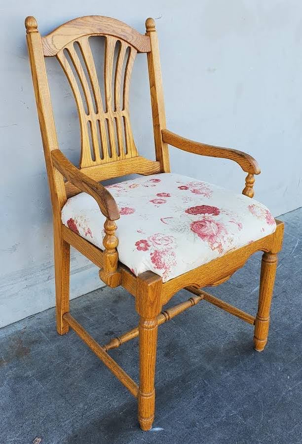 Light wood armchair white floral cushion