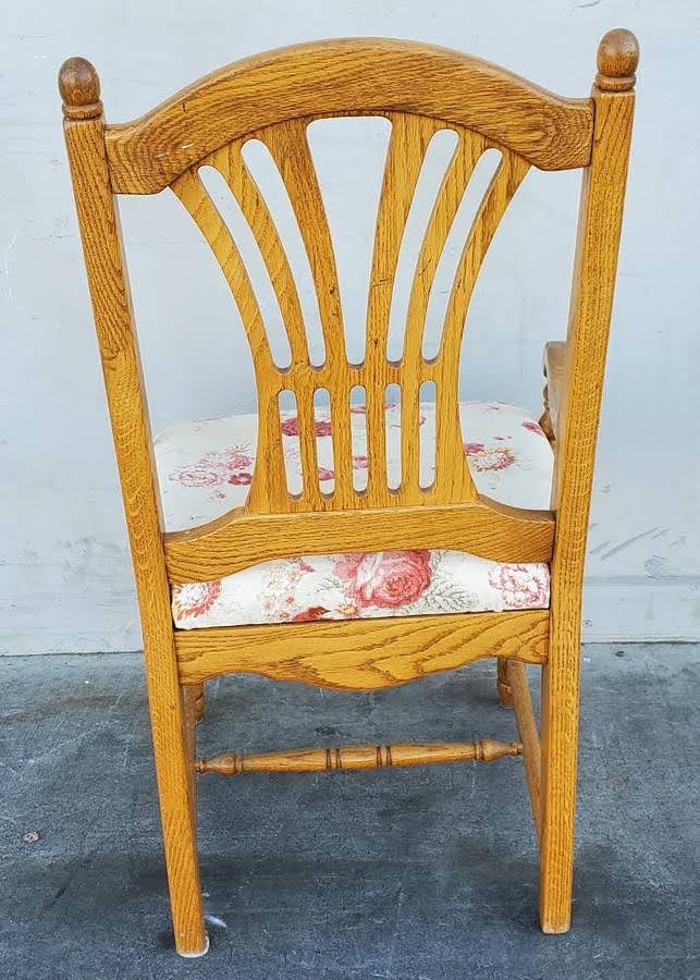 Light wood armchair white floral cushion