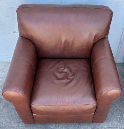 Brown leather armchairs