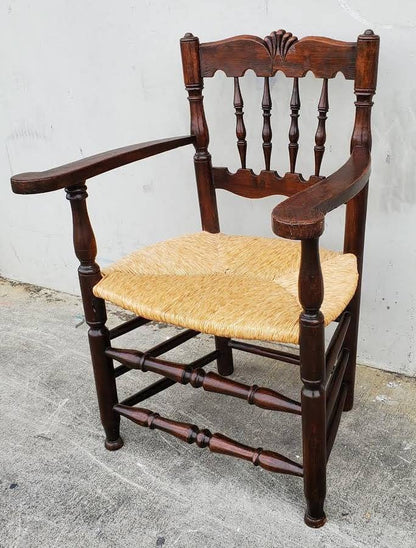 Armchair wicker seat dark wood