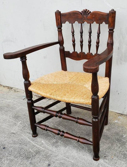 Armchair wicker seat dark wood