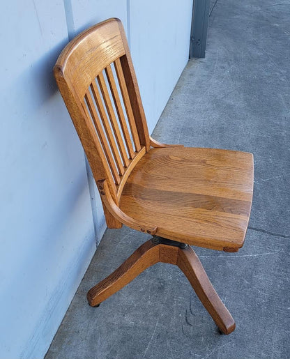 Antique/ vintage oak swivel office/bankers  rolling chair on wheels