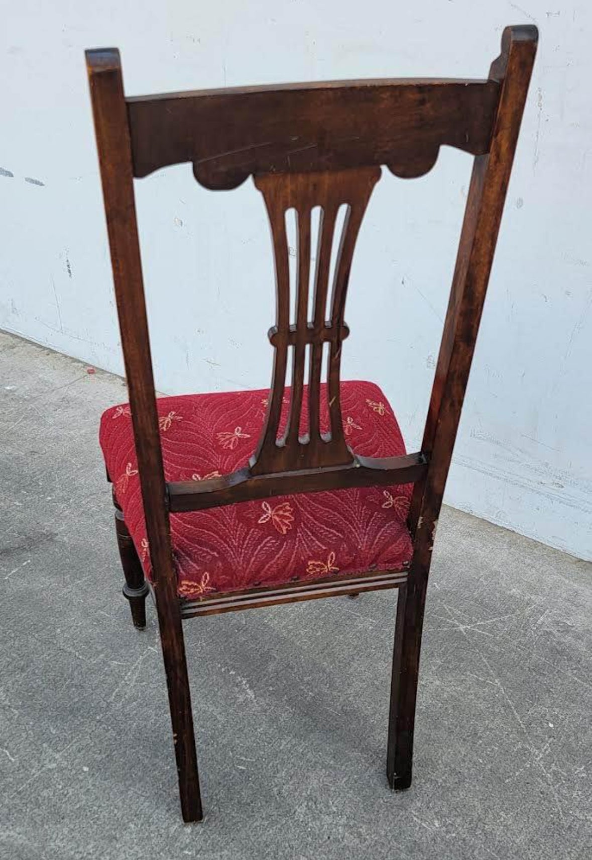 Antique carved chair burgundy cushion