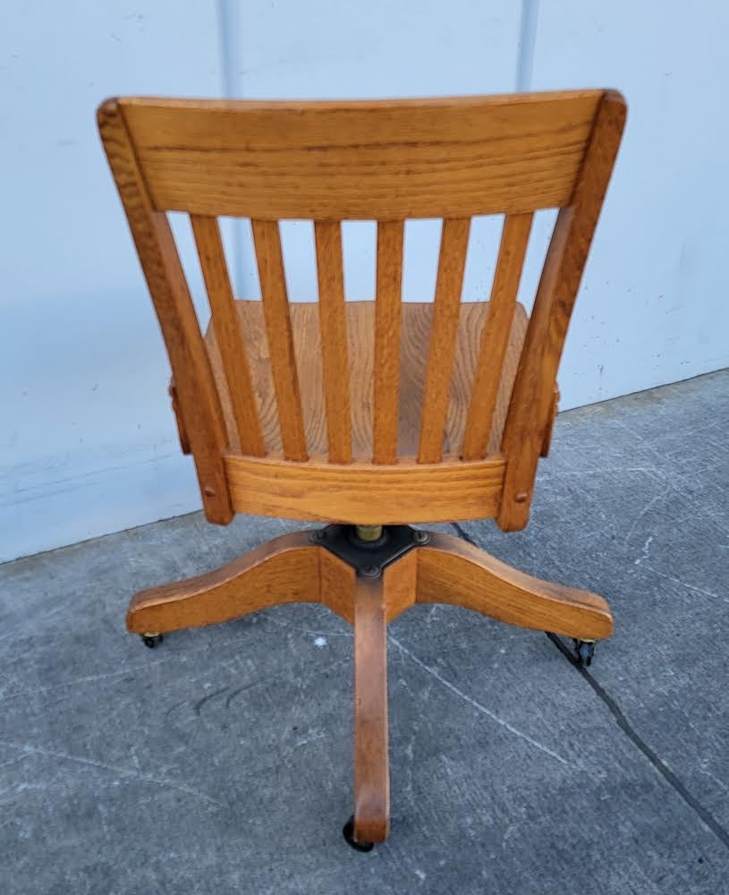 Antique/ vintage oak swivel office/bankers  rolling chair on wheels
