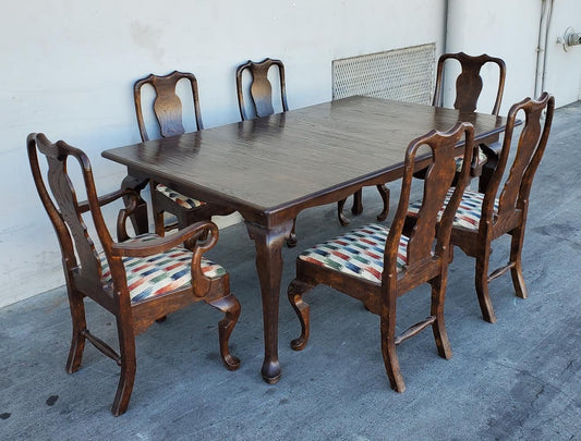 Dark wood dining table with 6 chairs