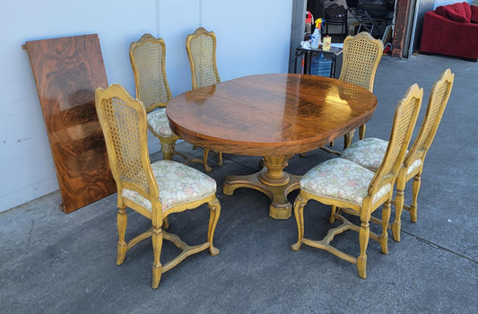 Dining table with 6 wicker high back chairs and leaf