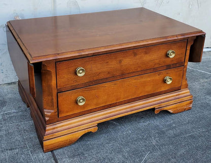 Broyhill coffee table with 2 drawers and side drop down extensions