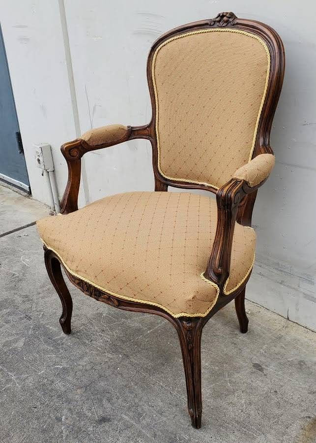 Gilberd’s tan/dark wood armchair