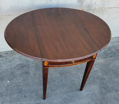 Oval end/side table with drawer drop sides