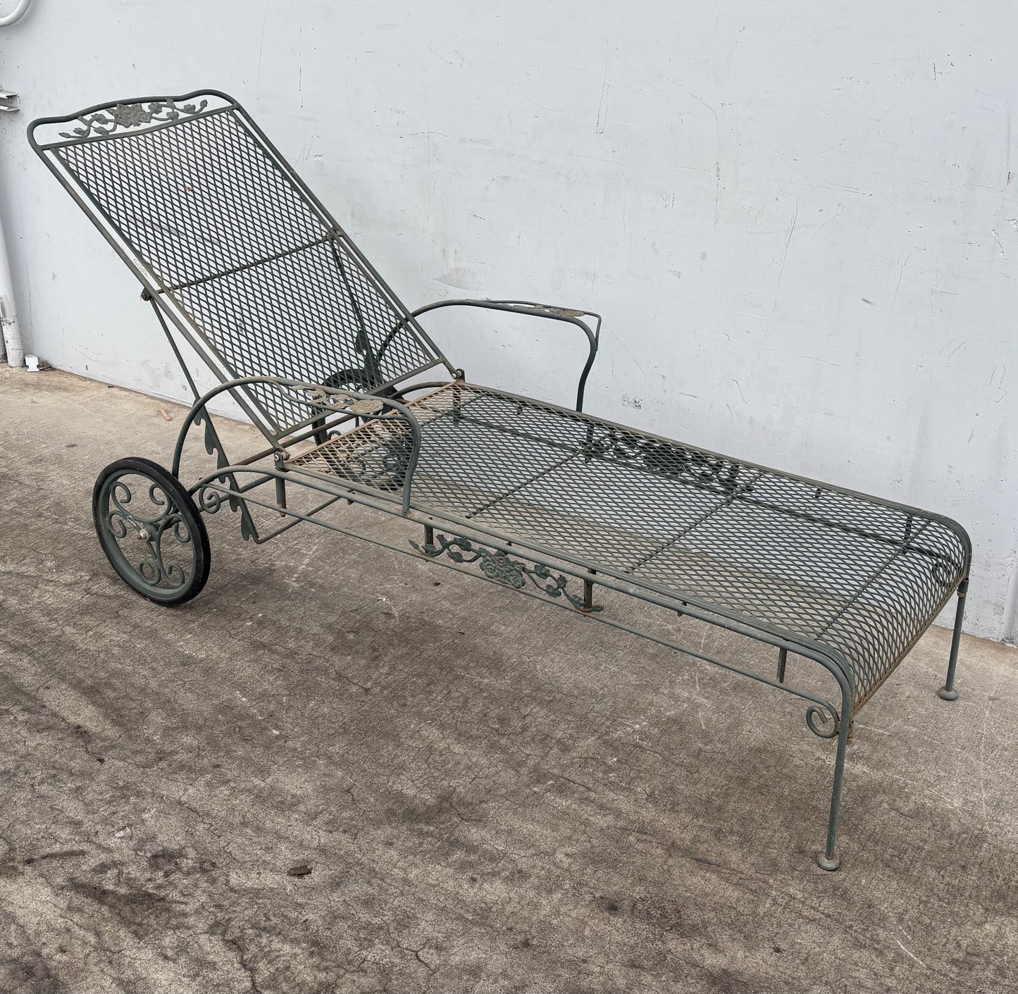 Vintage Wrought iron flower patter garden chaise lounge chair with wheels
