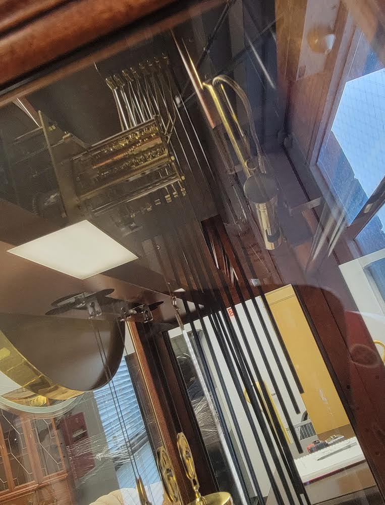 howard miller grandfather clock with curio
