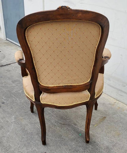 Gilberd’s tan/dark wood armchair