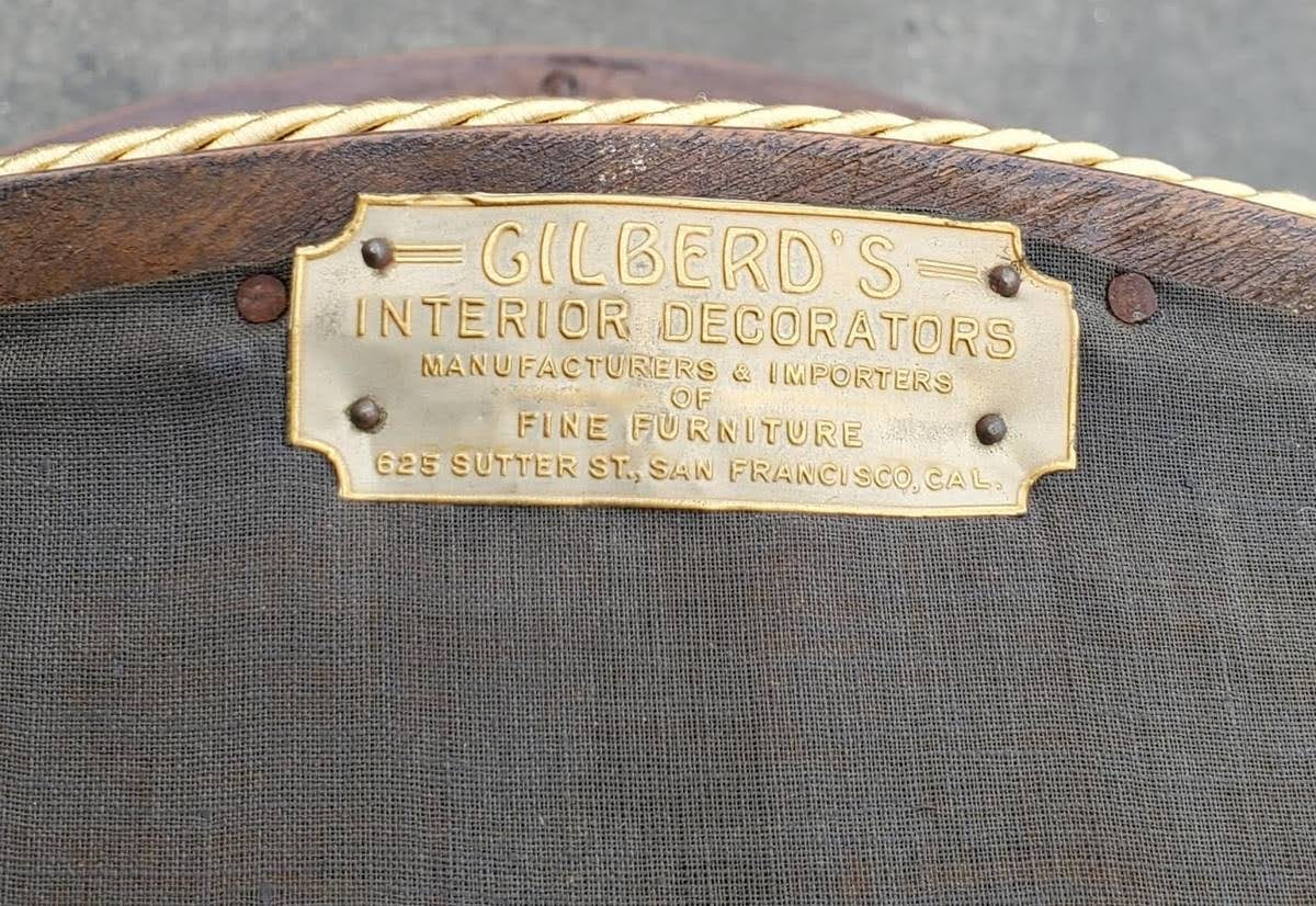 Gilberd’s tan/dark wood armchair