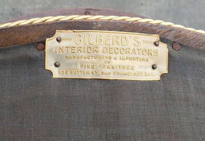 Gilberd’s tan/dark wood armchair