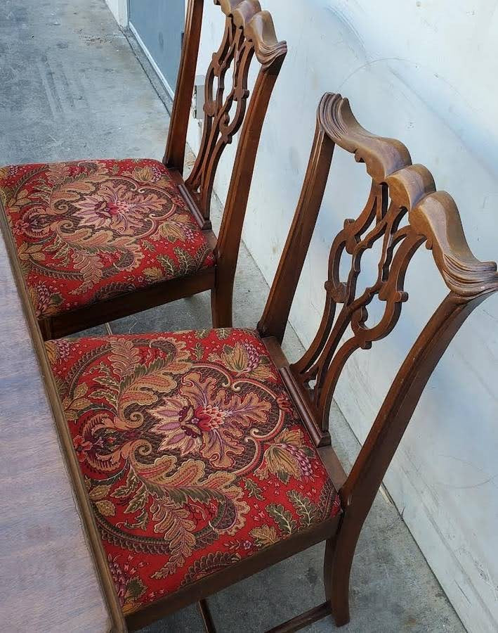 Antique/vintage dining table with 4 chippendale style chairs red floral cushions