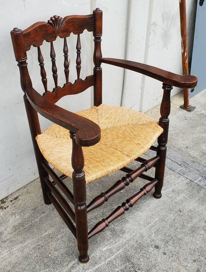 Armchair wicker seat dark wood