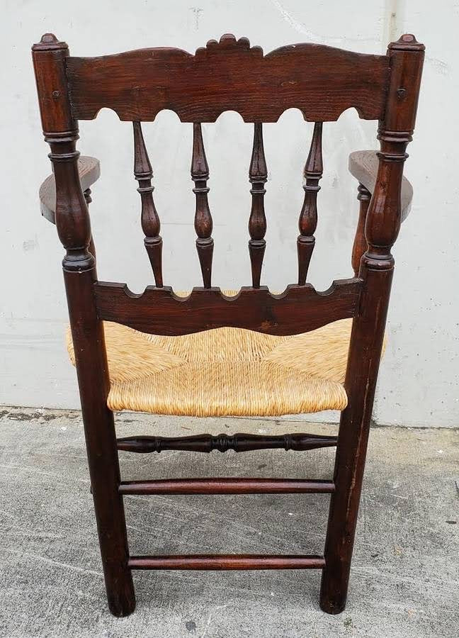 Armchair wicker seat dark wood
