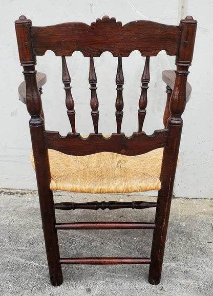 Armchair wicker seat dark wood