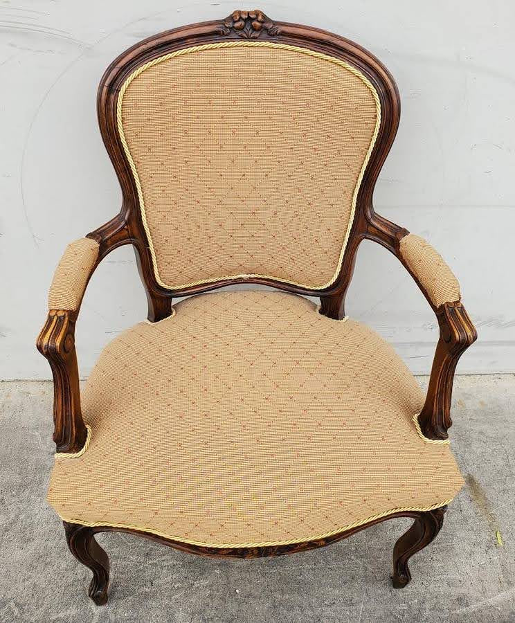 Gilberd’s tan/dark wood armchair