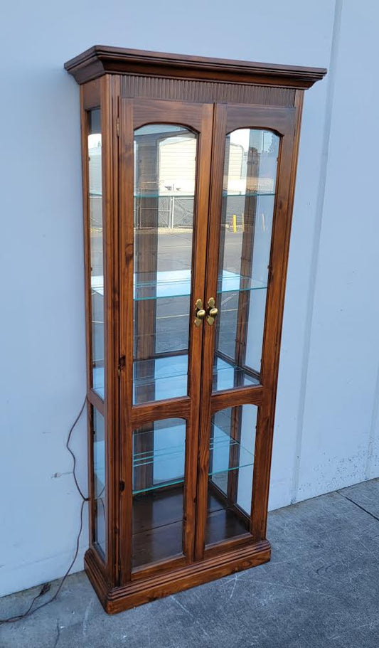 Dark wood lighted display cabinet
