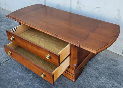 Broyhill coffee table with 2 drawers and side drop down extensions